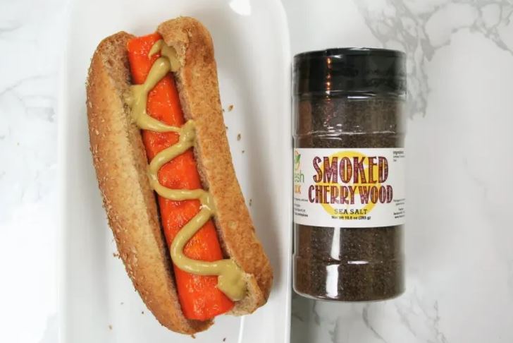 A Carrot hot dog in a wheat bun