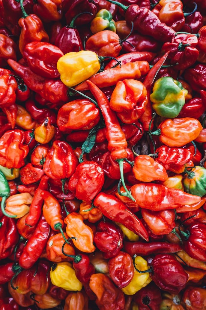 Pile of Peppers used in Spicy Seasonings: Ancho, Chili, Sriracha, and Ghost