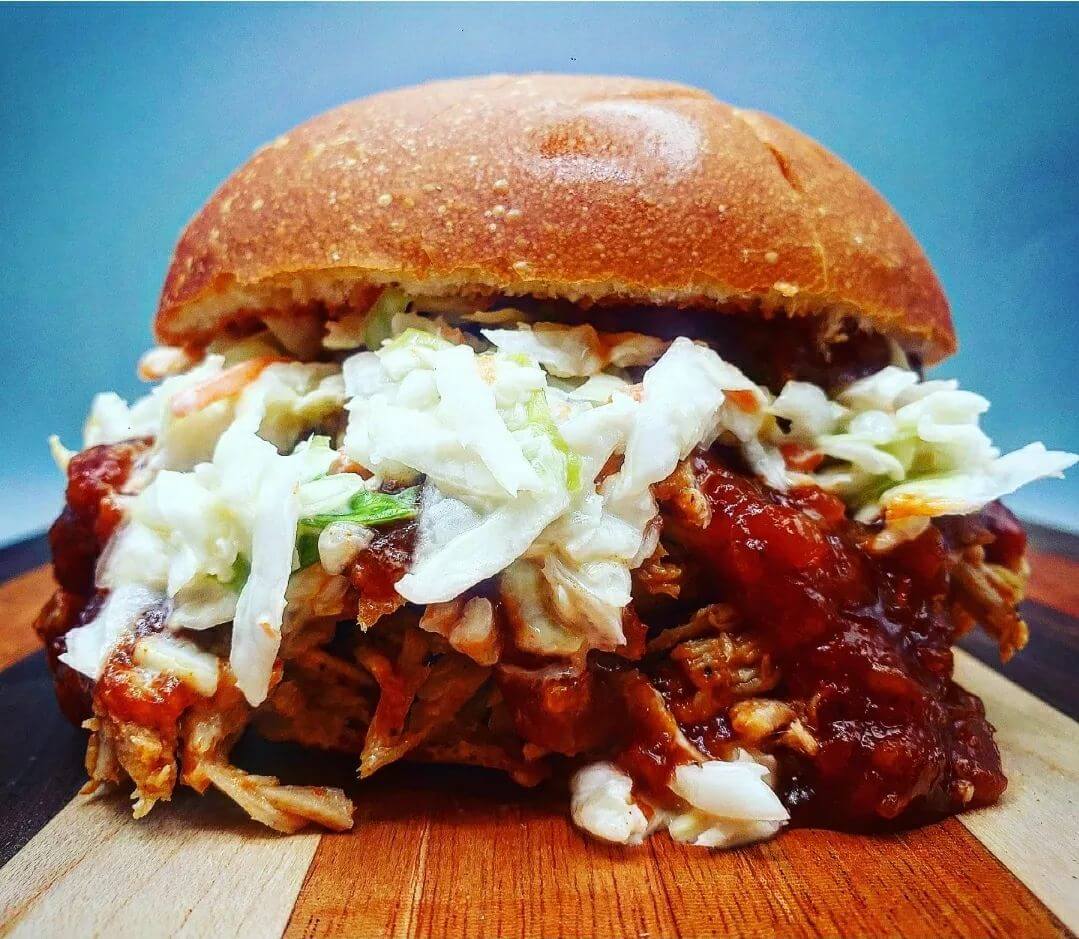 BBQ Pulled Pork Sandwich topped with BBQ Sauce, Coleslaw, and Hog Heaven Seasoning