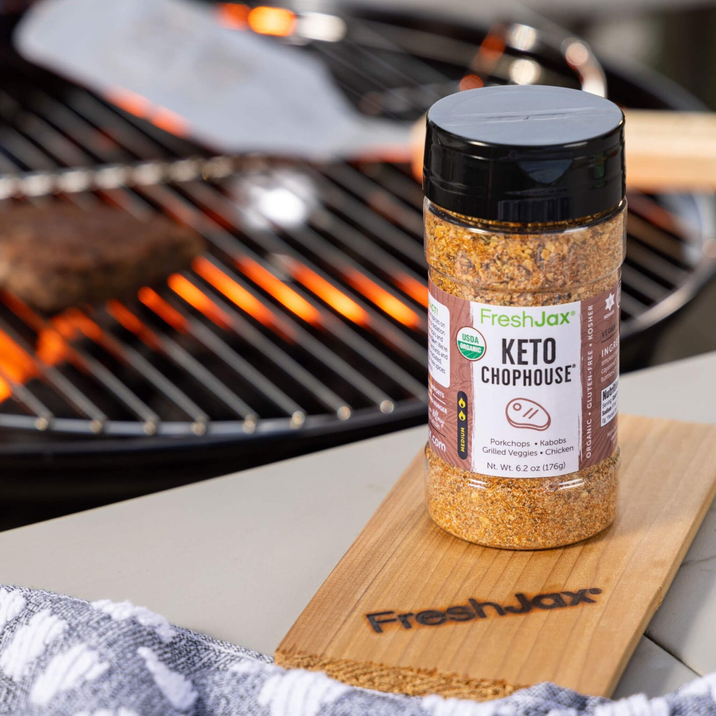Keto Chophouse seasoning next to grill