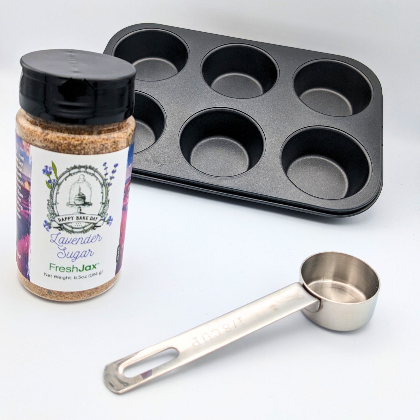 FreshJax Organic Spices | Happy Bake Day Show Lavender Sugar next to measuring cup and muffin pan