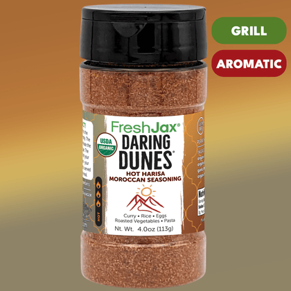 Bottle of FreshJax Daring Dunes Hot Harisa Moroccan Seasoning with a brown gradient background.