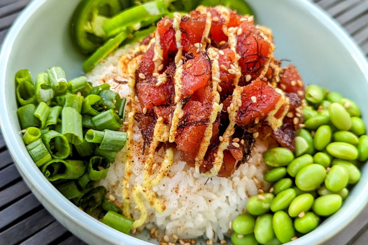 Poke Bowl with Fish, rice, edamame, scallions and jalapenos