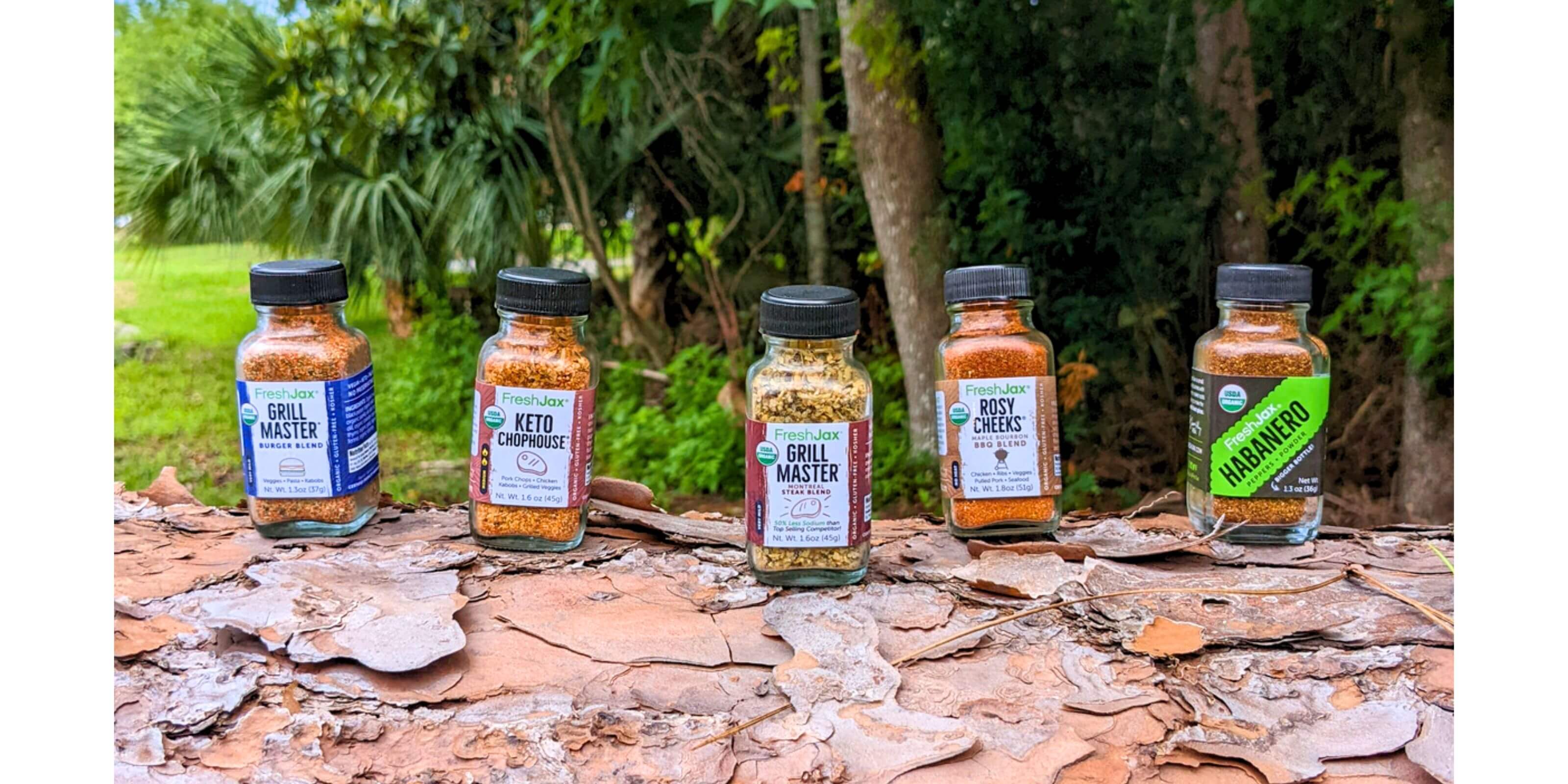 Sampler Size Organic Seasonings and Spices on a Fallen Tree
