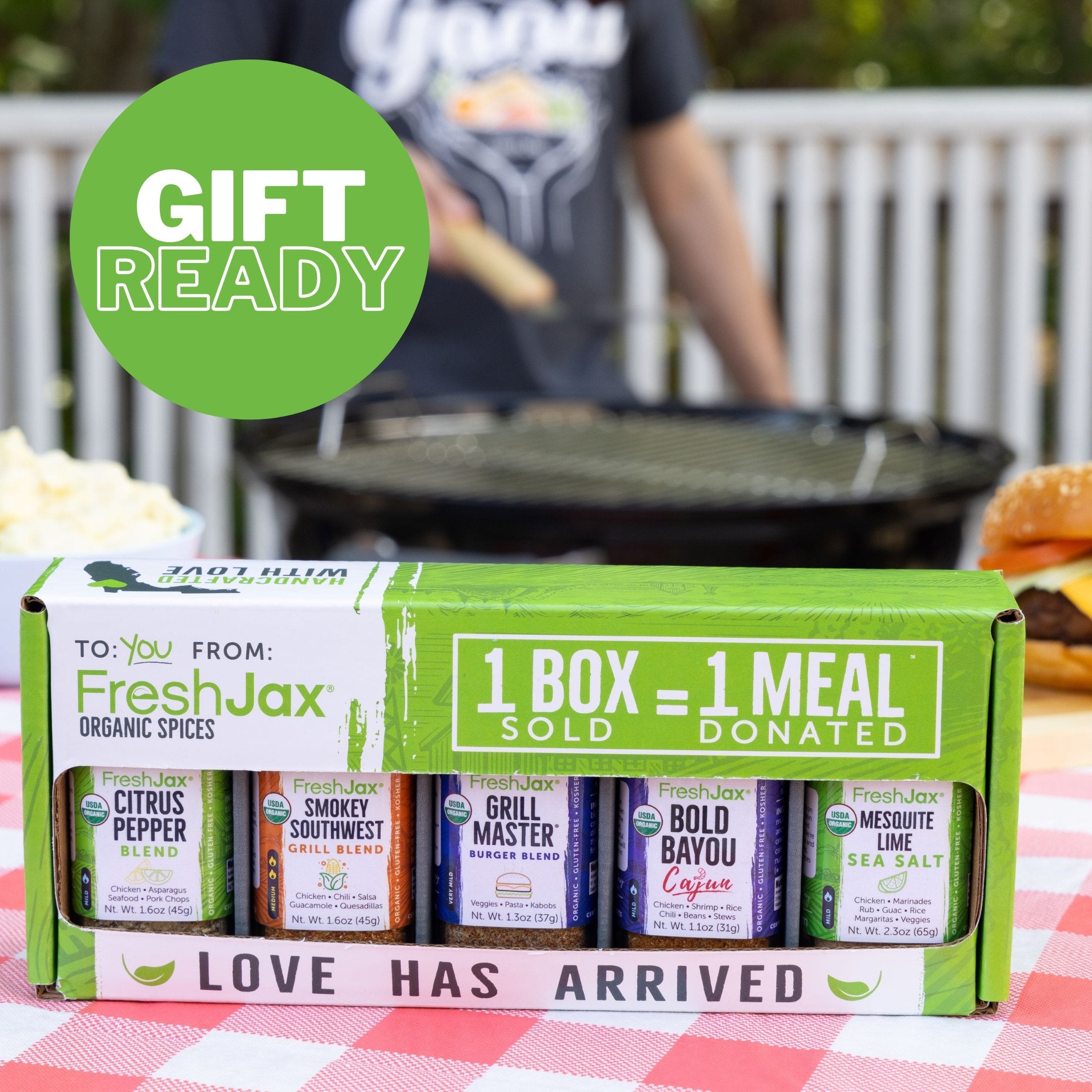 FreshJax Organic Spices Grill and BBQ 6-Pack in a gift box on a picnic table