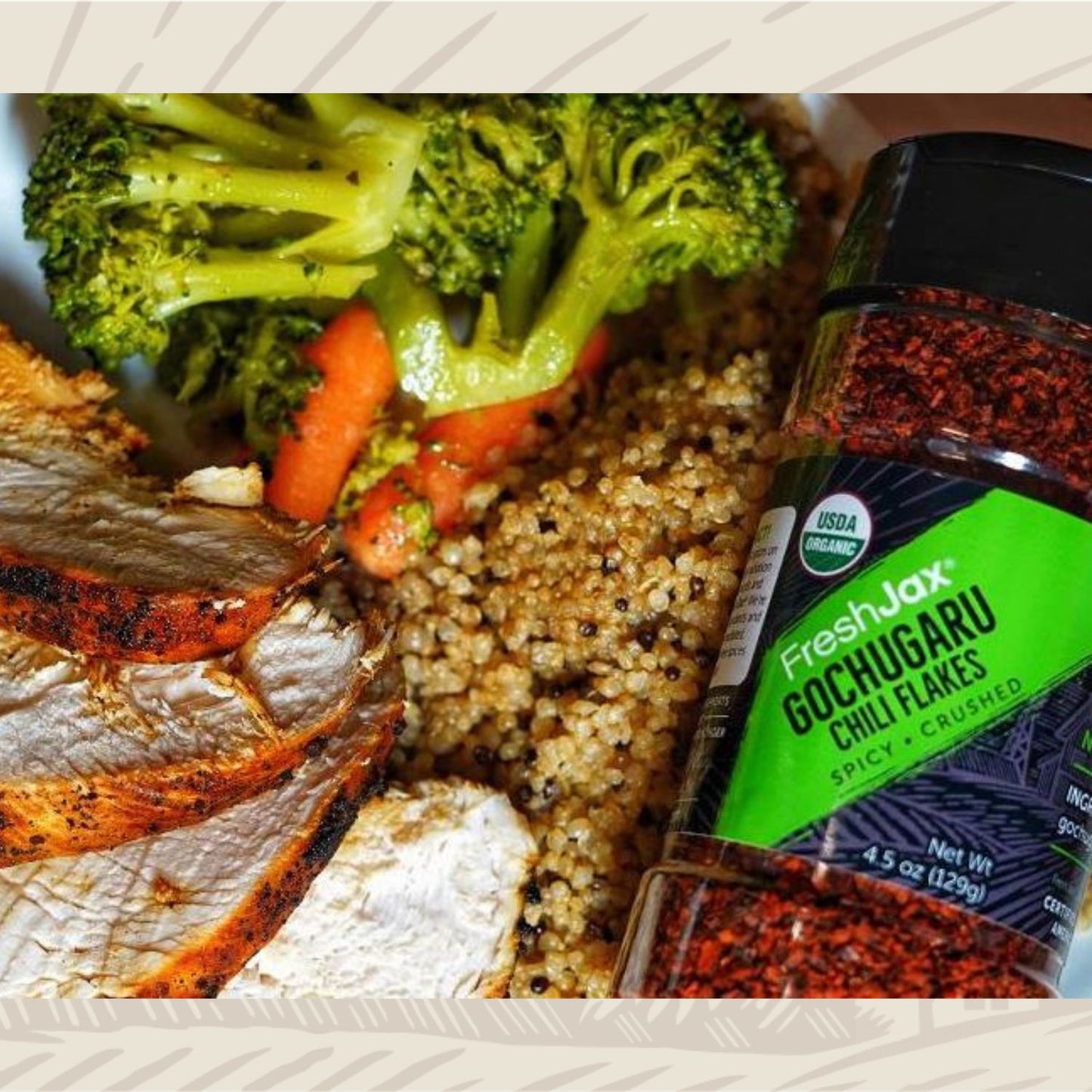 Bottle of Gochugaru Chili Flakes next to grilled chicken veggies and couscous