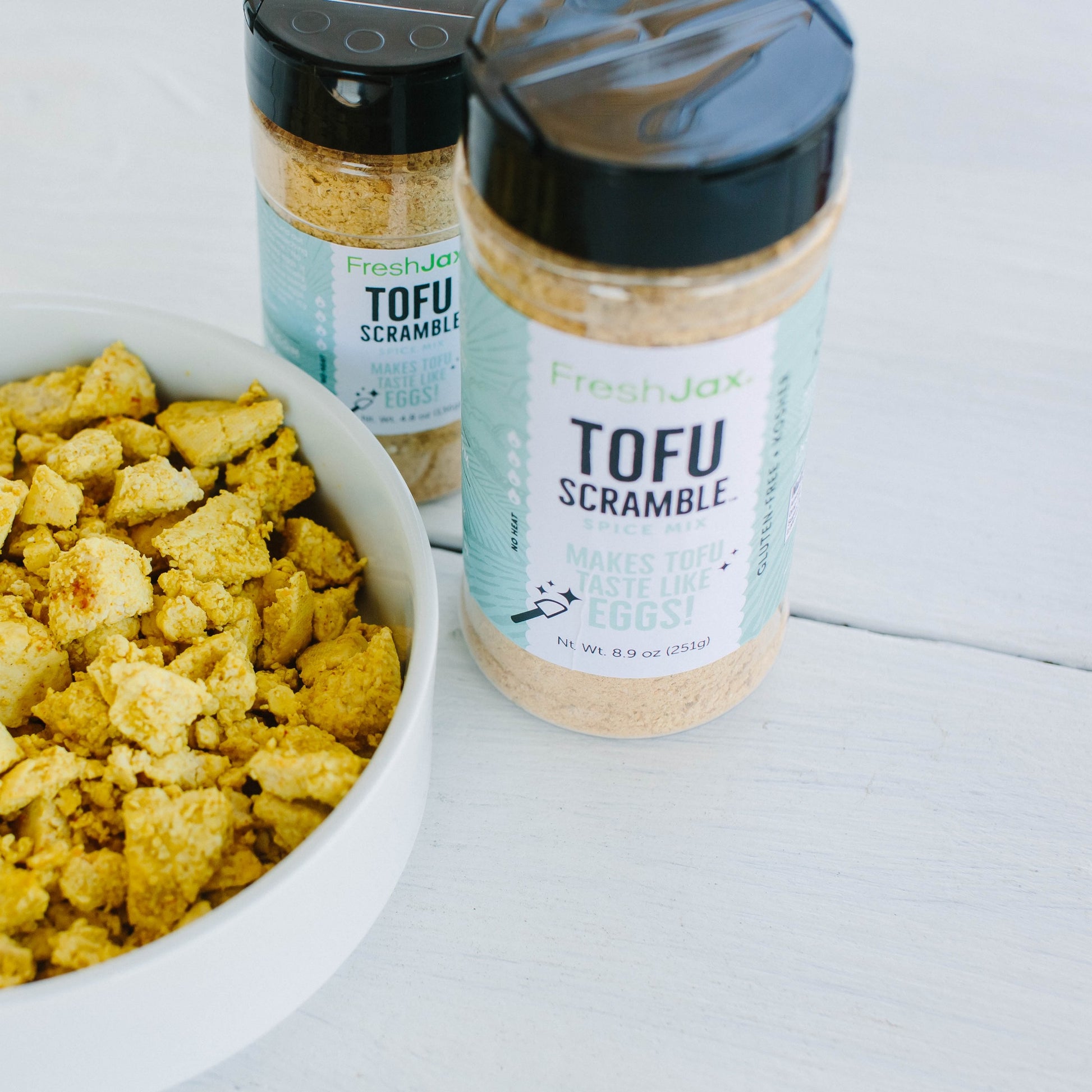 Tofu Scramble Seasoning next to bowl of tofu